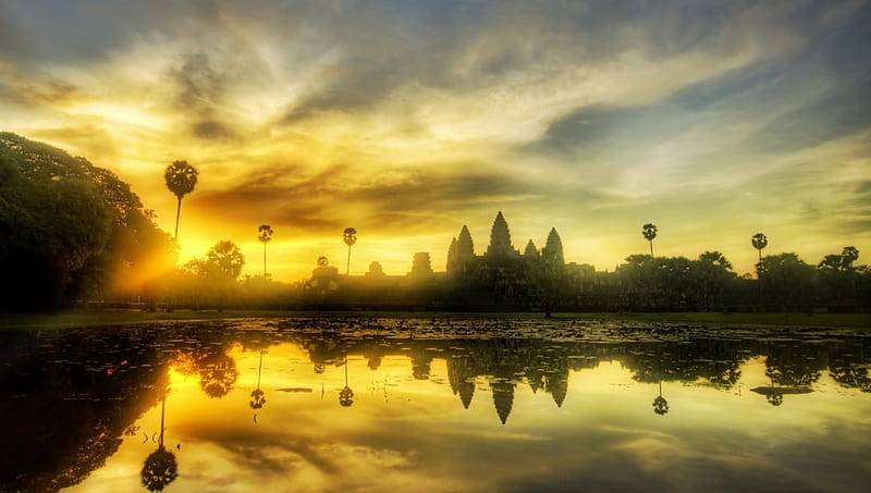 https://www.cambodiatraveltour.com/wp-content/uploads/2023/10/HD-wallpaper-angkor-wat-cambodia-temple-sunrise-trees-lake.jpg